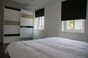 Postel nebo postele na pokoji v ubytování Pärnu Lubja Apartments
