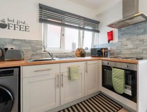 Kuchyň nebo kuchyňský kout v ubytování Urban Hideaway