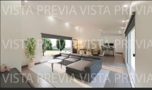 a living room with a couch and a table at Casa Blanca in Sencelles