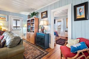 a living room with a couch and a stove at Arcadia in Kill Devil Hills +41 photos