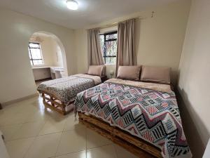 Postel nebo postele na pokoji v ubytování ZZZ hostel Nairobi