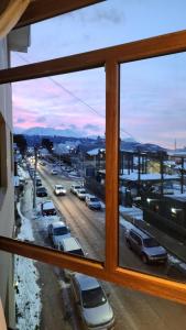 a view from a window of a parking lot at Hotel Vitalia in Ushuaia