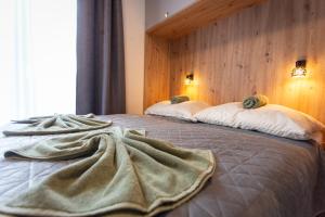 En eller flere senge i et værelse på Levander