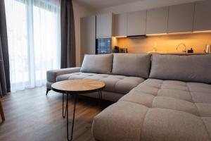 a living room with a couch and a table at Levander in Králiky