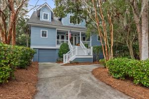 a blue house with an american flag at 1006 Crooked Oaks in Seabrook Island