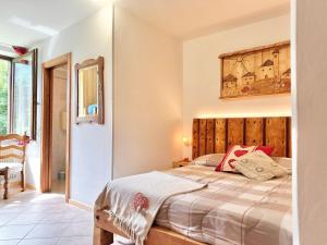 Postel nebo postele na pokoji v ubytování Chalet Rustico Bertolini per Gruppi!