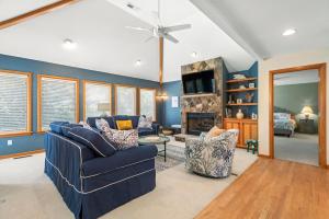 a living room with a couch and a fireplace at Blue Oasis in Duck