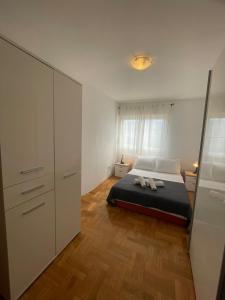 a bedroom with a bed and a large closet at Apartment Sara in Solin
