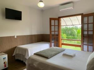 Pousada Estância Travessia客房内的一张或多张床位