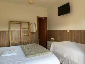 Pousada Estância Travessia客房内的一张或多张床位