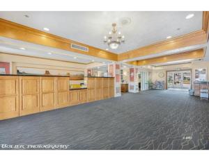 a large lobby with a large room with wooden walls at Highland Estates Condotel in Mesquite