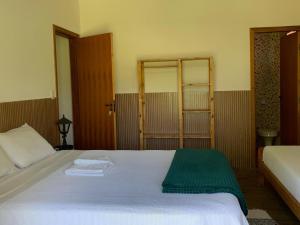 Pousada Estância Travessia客房内的一张或多张床位