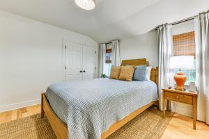 a bedroom with a bed and a window at Home 2 Mi to Beach and Old Town Bay St Louis! in Bay Saint Louis