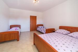Postel nebo postele na pokoji v ubytování Apartments 10 meters from the beach
