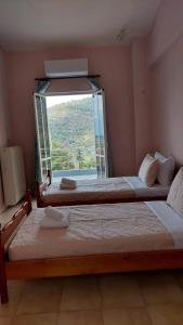 Ένα ή περισσότερα κρεβάτια σε δωμάτιο στο Galini apartments