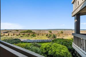 a view from the balcony of a house at 1327 Pelican Watch Villa in Seabrook Island