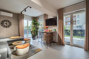 a living room with a couch and a table at Premium Apartment Eleven in Zator