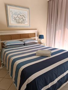 Ένα ή περισσότερα κρεβάτια σε δωμάτιο στο Seabrook Vacations Suite 212 +12 φωτογραφίες