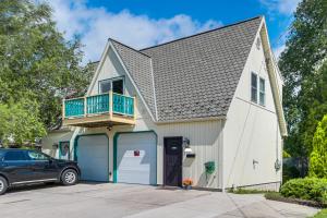 a house with a balcony and a garage at Walk to Town Charming Unit with Balcony in Bedford! in Bedford