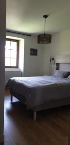 a bedroom with a large bed in a room at Le château in Annecy