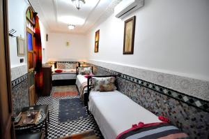 Postel nebo postele na pokoji v ubytování Riad Tafoukt Fes + 37 fotografií