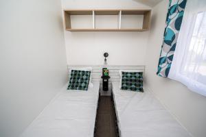 Llit o llits en una habitació de Vacances Vendée face à l'Océan 18 fotos més