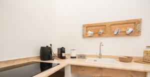 Nhà bếp/bếp nhỏ tại Porto Antico Luxury Rooms