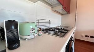 a kitchen with a green appliance on a counter at Casa Lilla in Verona