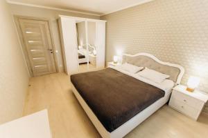 Ένα ή περισσότερα κρεβάτια σε δωμάτιο στο Luxury Big Family Apart on Golovna поряд з ТЦ ДЕПОТ та АТБ