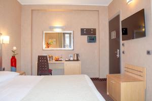 Postel nebo postele na pokoji v ubytování Hotel Susa