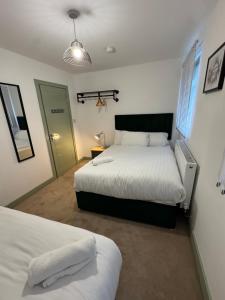 Ένα ή περισσότερα κρεβάτια σε δωμάτιο στο CityWest Apartments