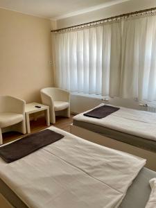 Voodi või voodid majutusasutuse Penzion Apartmány Adamčík toas