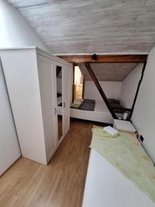 a small room with a bed and a ceiling at Apartment Kp with parking in Koper