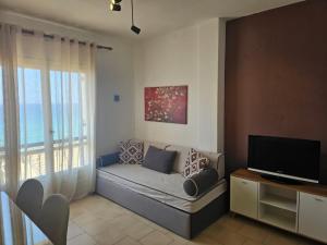 Televízia a/alebo spoločenská miestnosť v ubytovaní Corfu Dream Holidays Villas
