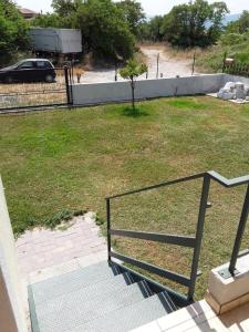 a set of stairs leading to a yard with a tree at Il Tuffatore in Capaccio-Paestum