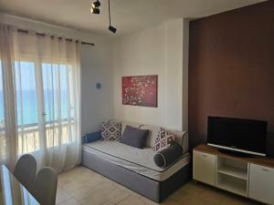 Televízia a/alebo spoločenská miestnosť v ubytovaní Corfu Dream Holidays Villas