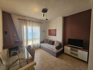 Televízia a/alebo spoločenská miestnosť v ubytovaní Corfu Dream Holidays Villas