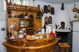 a kitchen with a table with food on it at B&B La Gerbolina in San Giusto Canavese +32 photos