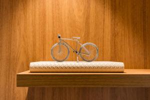 a bike sitting on top of a wooden shelf at TW Cyclinn Vila Olimpia in São Paulo