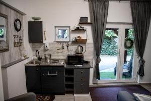 a kitchen with a sink and a counter top at Studio '98 Apartments broj 31 in Sisak