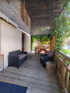 a patio with two couches and a fire place at Appartement 5 pax à la ferme - Risoul village in Risoul