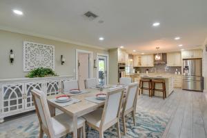 a kitchen and dining room with a table and chairs at 16 Mi to Fort Lauderdale Florida Escape with Pool! in Plantation