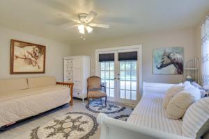 a living room with a couch and a ceiling fan at 16 Mi to Fort Lauderdale Florida Escape with Pool! in Plantation +32 photos