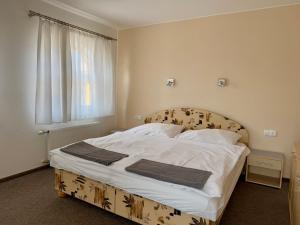 Voodi või voodid majutusasutuse Penzion Apartmány Adamčík toas