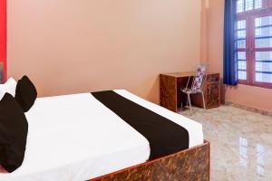 Postel nebo postele na pokoji v ubytování Super Hotel O Kashvi Hotel + 21 fotografií