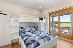 A bed or beds in a room at Changes In Attitude
