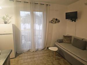 Televízia a/alebo spoločenská miestnosť v ubytovaní Corfu Dream Holidays Villas