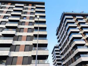 a tall building with many windows and a street light at EasyStay by Fuat in Struga