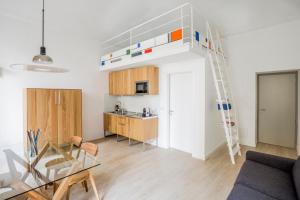 a living room and kitchen with a loft bed at TorinoToStay Apartments in Turin