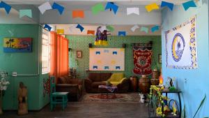 a living room with a couch and a table at Hostel Aruanda in Belo Horizonte